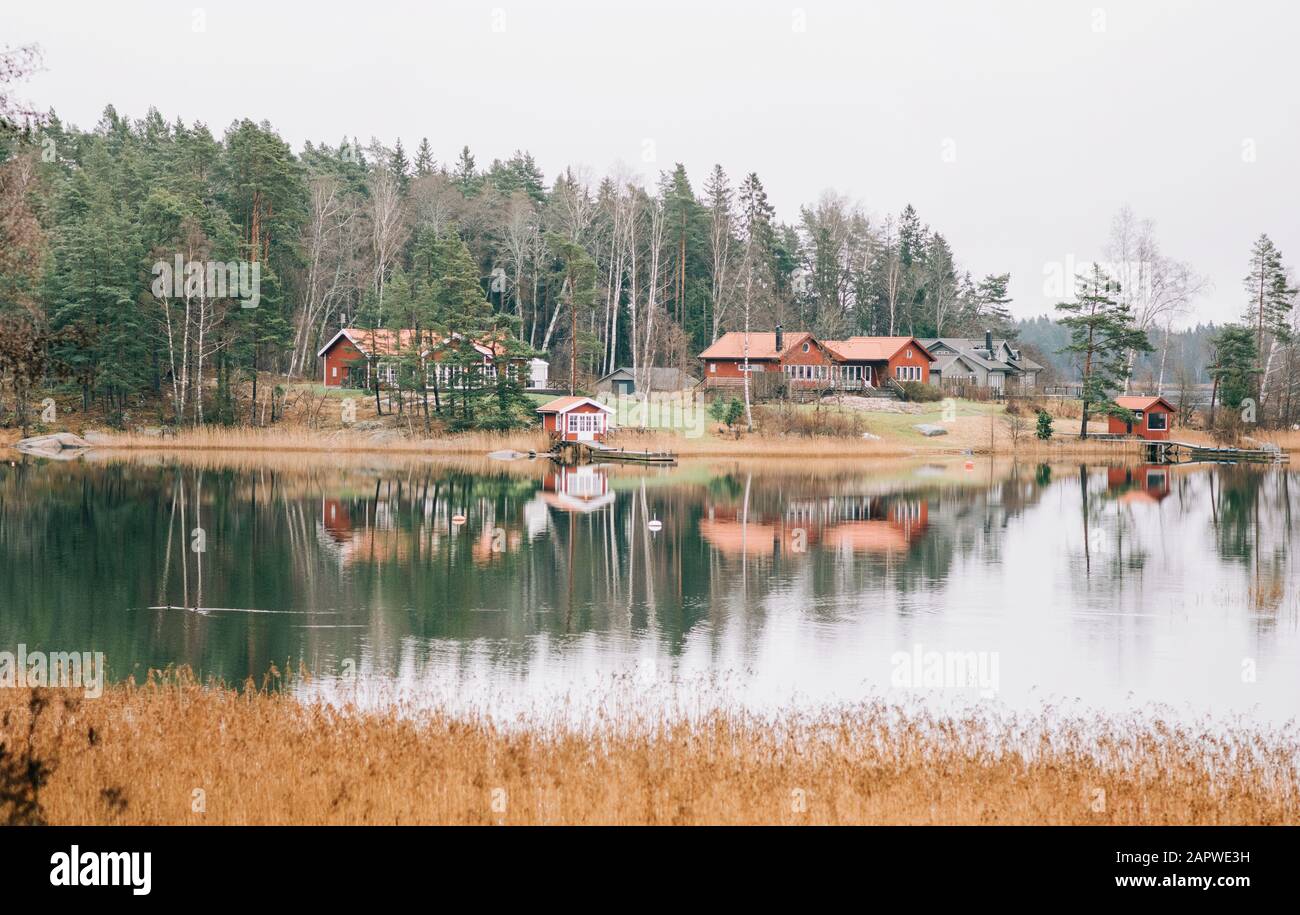 Traditional Swedish Scandinavian red house lined along the sea Stock Photo