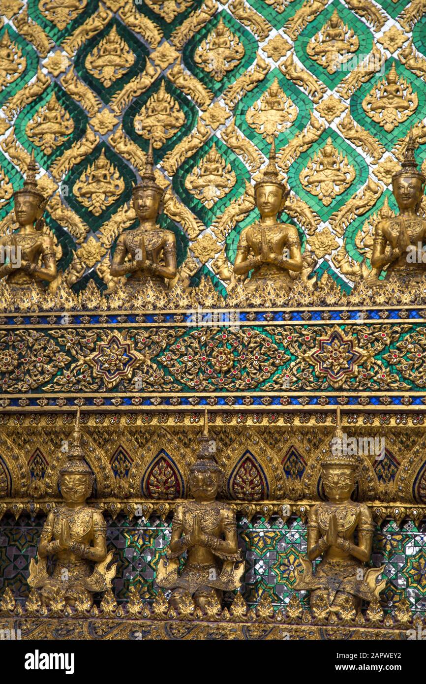 Golden, green and blue wall Thai decorations at The Grand Palace Stock Photo
