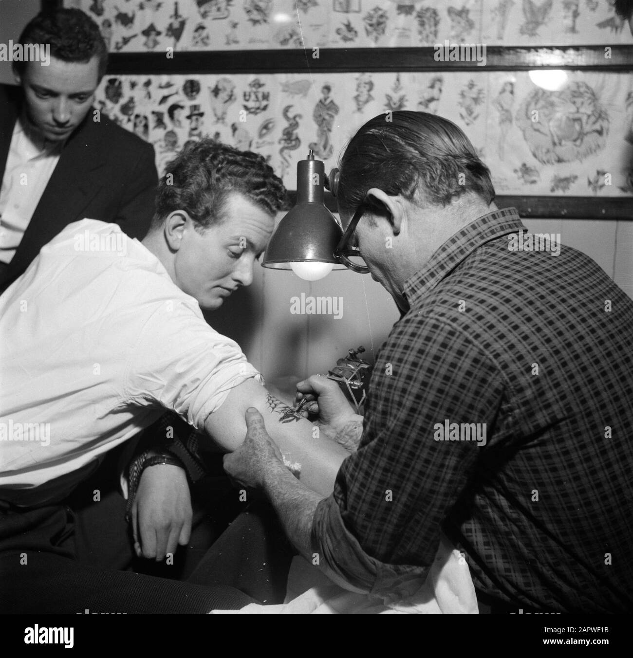 Visit to a tattoo shop in Copenhagen Man is tattooed by tattoo artist