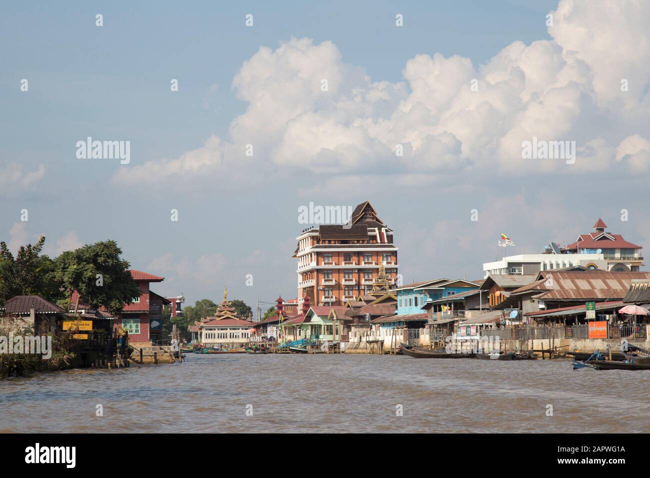 Water canal and buildings in Nyaungshwe Township, Inle Lake Stock Photo