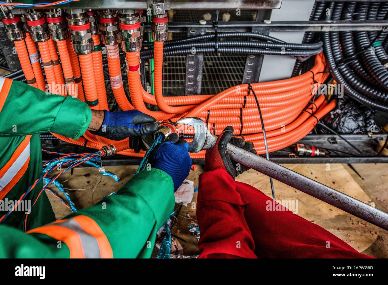 Electrical work onboard production platform construction Stock Photo