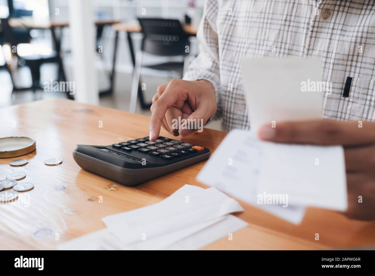 Finances Saving Economy concept. Accountant or banker calculate the cash bill. Stock Photo