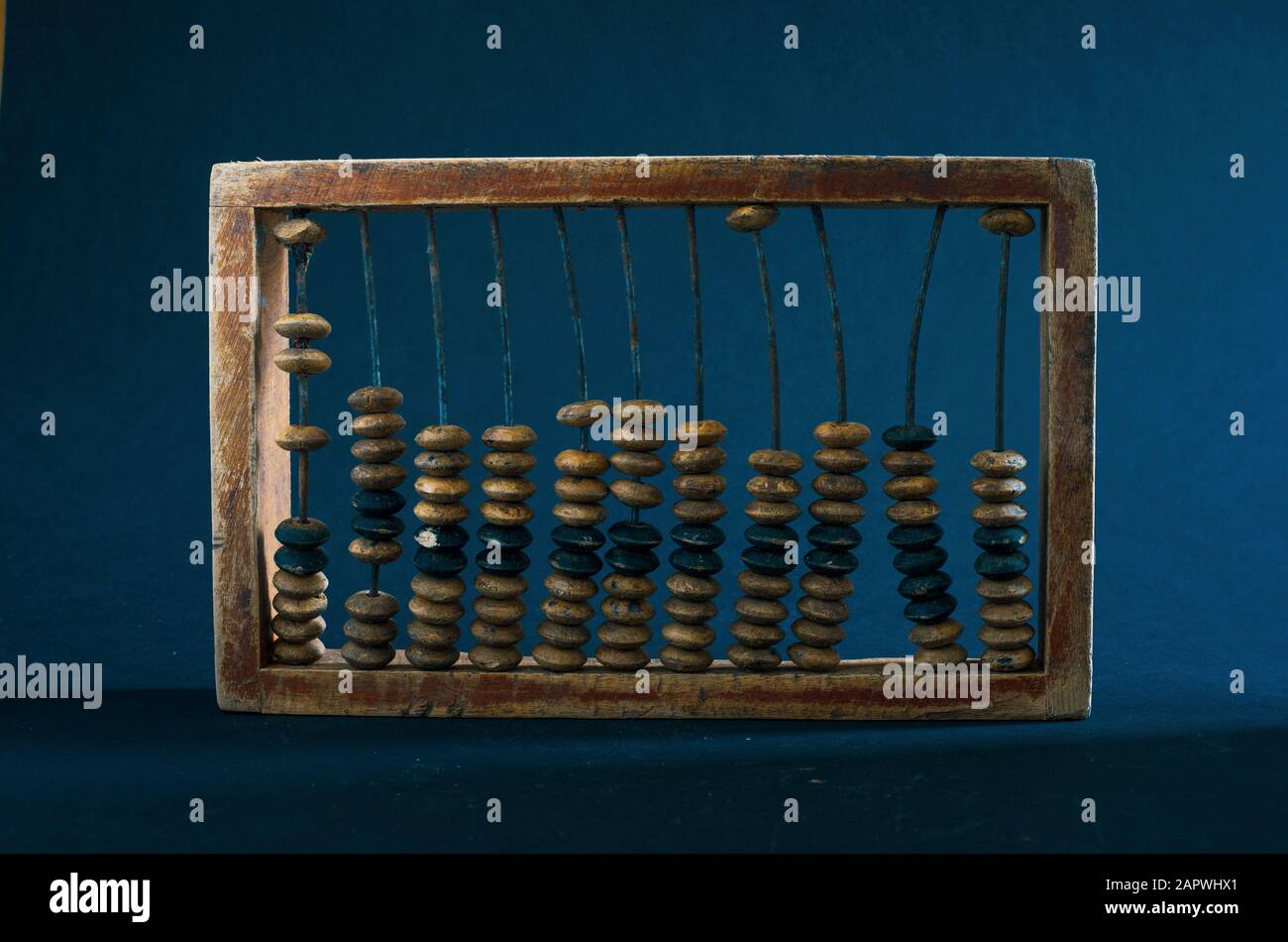 wooden abacus on a dark background Stock Photo