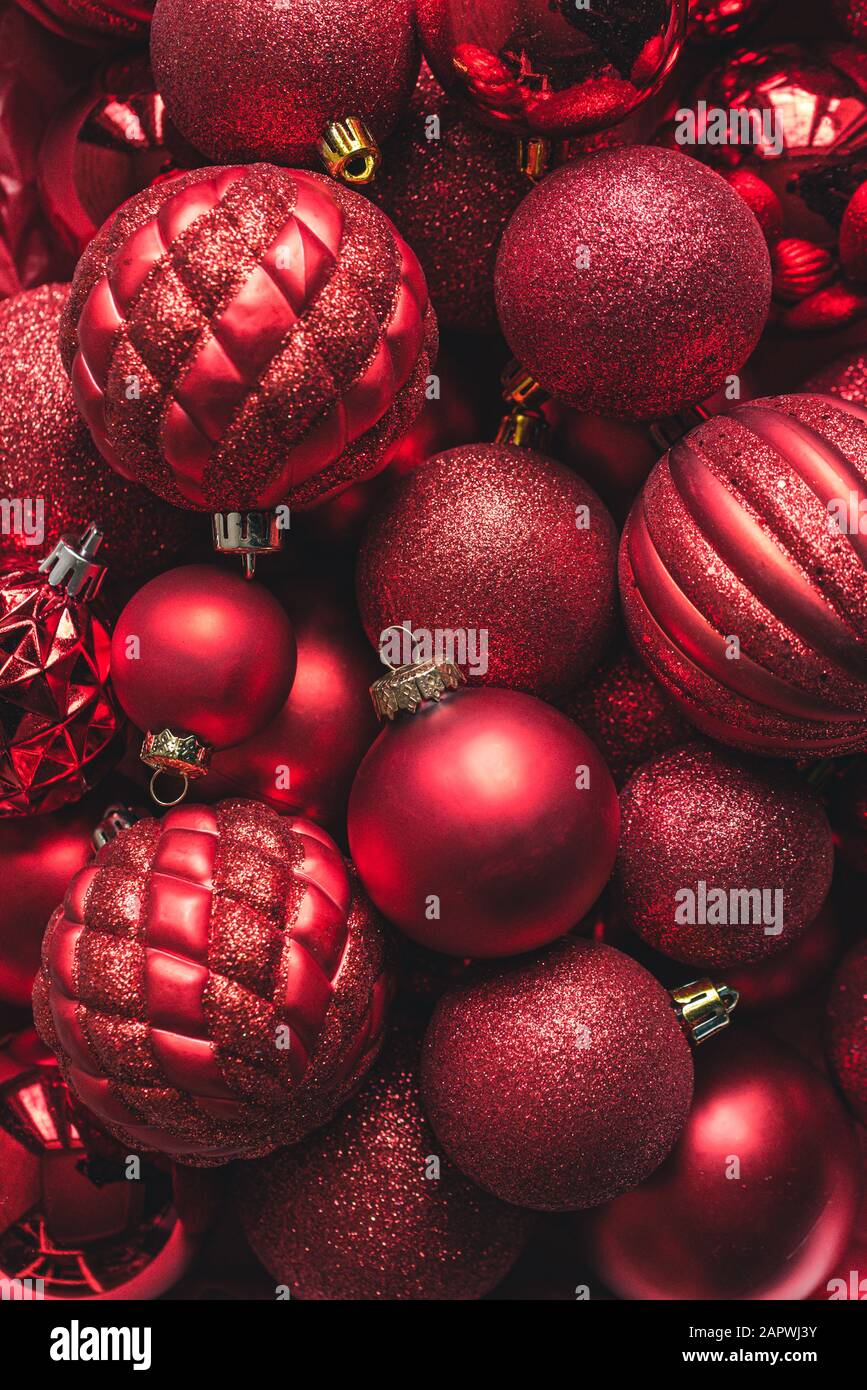 High angle close up of a variety of red christmas ball ornaments. Stock Photo