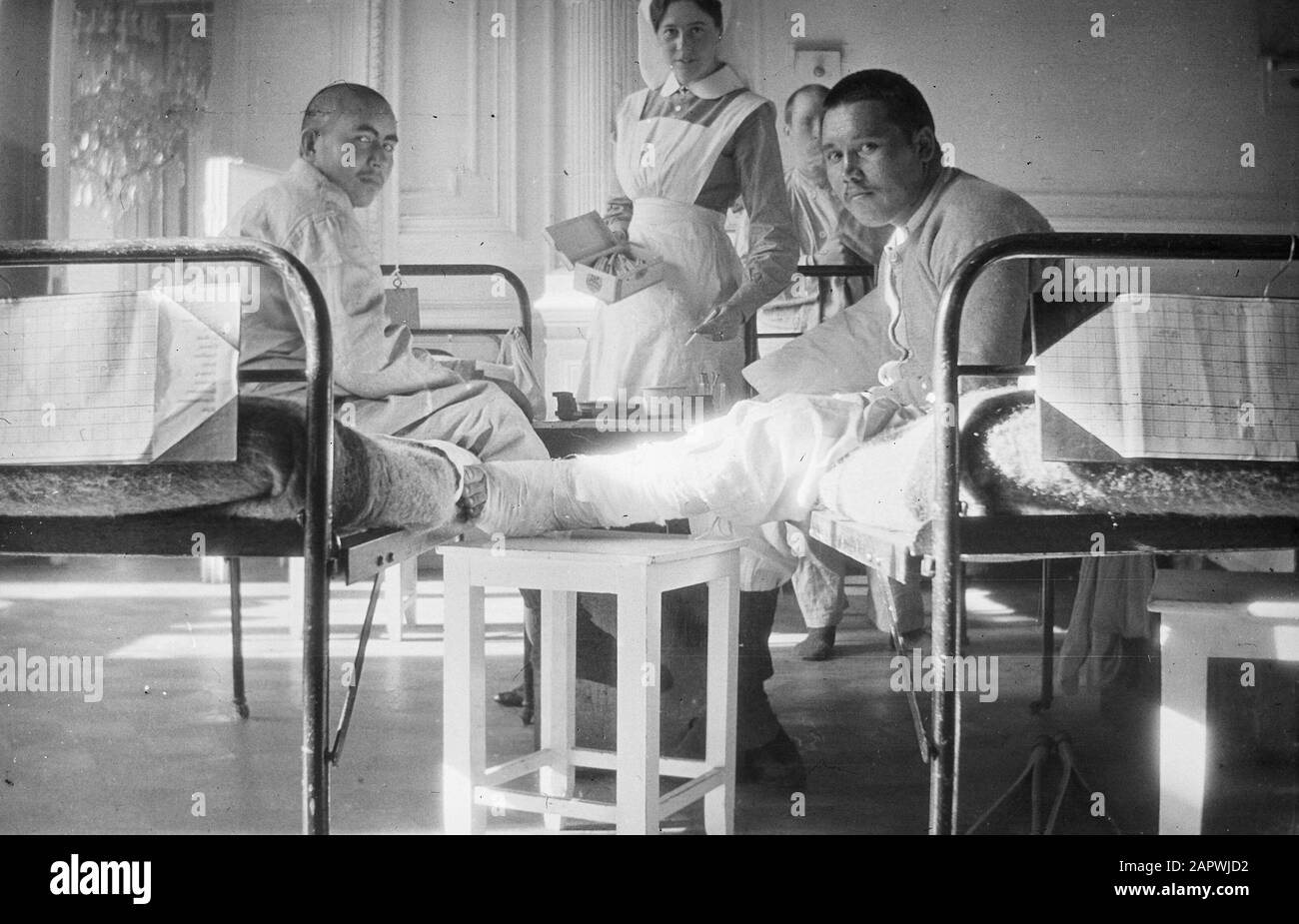 Visit to the Russian front at St. Petersburg  Wounded soldiers in an infirmary with nursing staff Date: 1916 Location: Russia Keywords: military, nursing staff Stock Photo