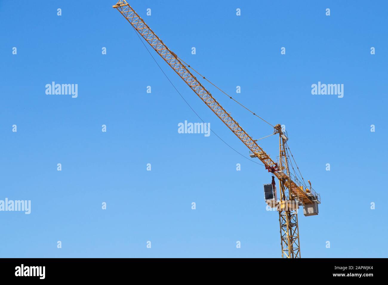 Low angle shot of a construction crane under the clear sky Stock Photo ...