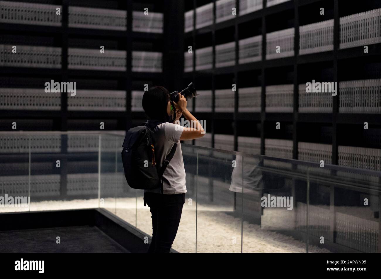 NANJING / CHINA - NOV 03 2019: The unspecific girl taking photo in the memorialize 300,000 people. It is to memorialize 300,000 people killed in the N Stock Photo