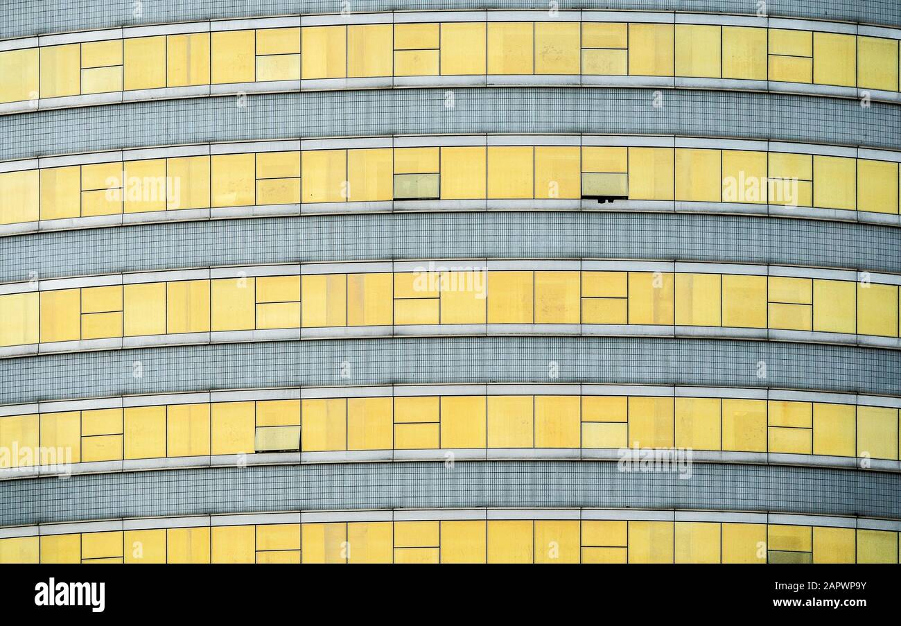 Closeup shot of the yellow windows of a modern building Stock Photo