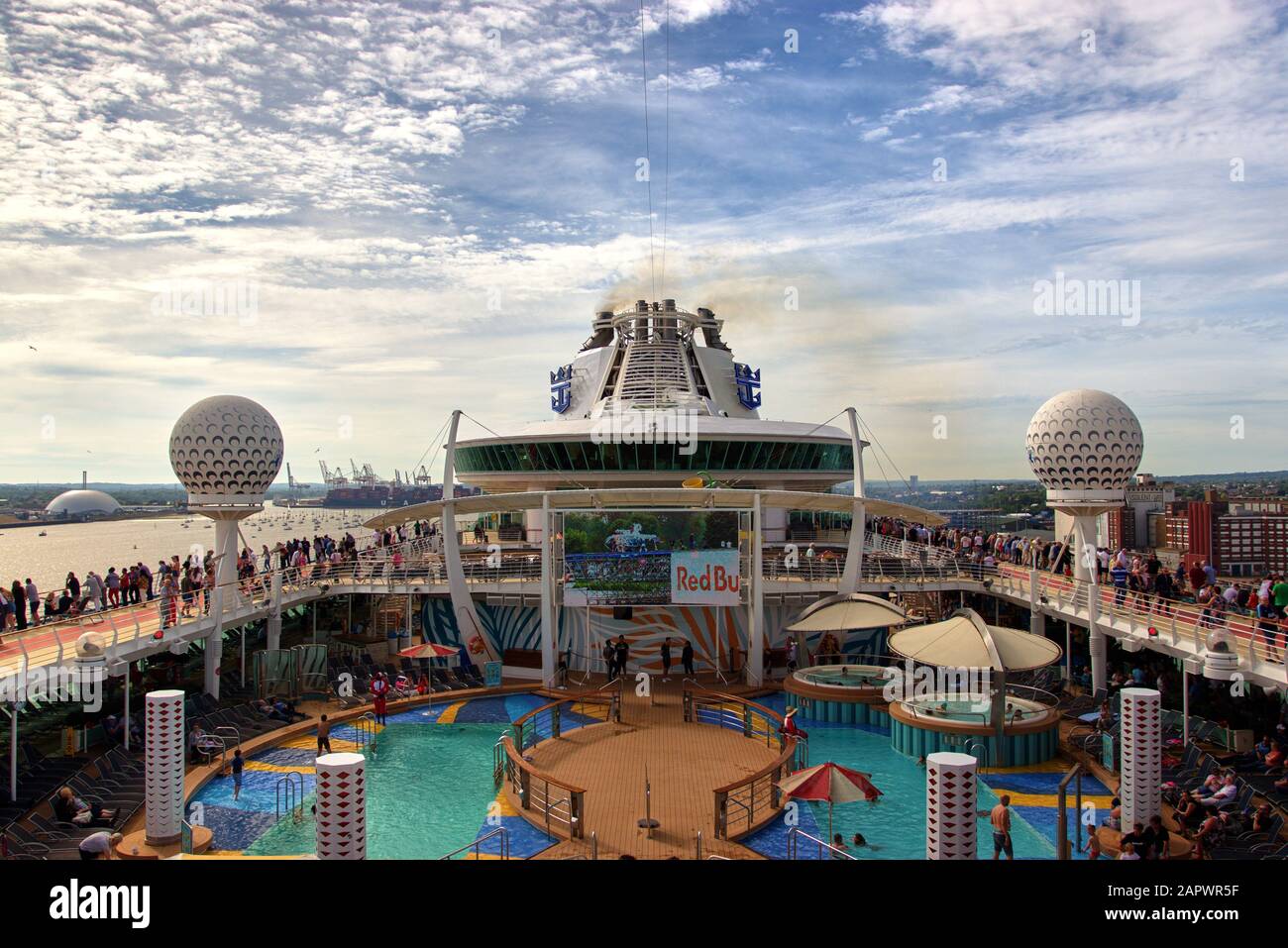 SOUTHAMPTON, UNITED KINGDOM - Jun 01, 2019: Horizontal shot looking over the top deck of a cruise ship as lots of smoke and pollutions enters the atmo Stock Photo