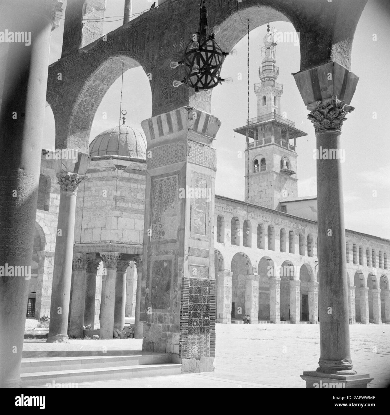 Middle East 1950-1955: Syria - Damascus  Omayad mosque, the north side of the forecourt with a minaret and fountain Date: 1950 Location: Damascus, Syria Keywords: fountains, minarets, mosques, columns Institution name: Omayyade Mosque Stock Photo