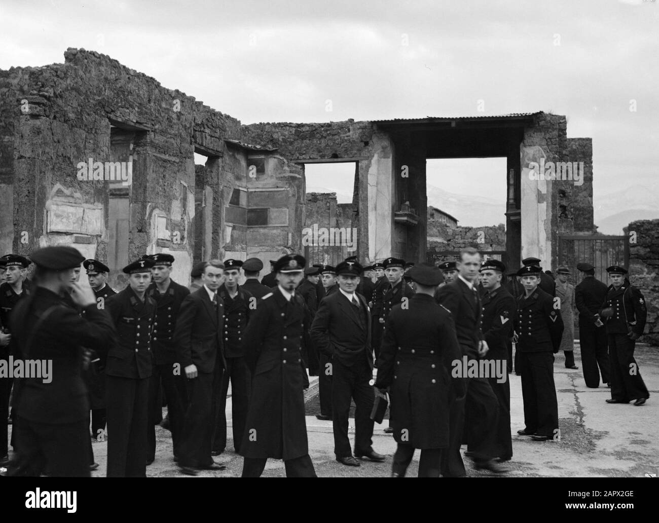 Visit to Naples and Vesuvius  Pompeii. Members of the German Kriegsmarine during an excursion Annotation: U-boat crew. Recognizable by headgear Unterseeboot Date: 1938 Location: Italy, Pompeii Keywords: archaeology, marine Stock Photo