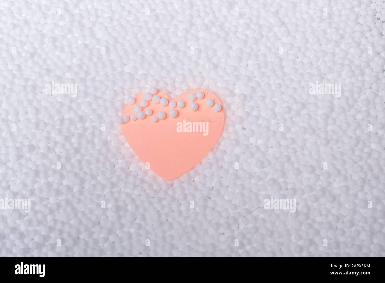 Pink color heart shaped paper as symbol of love Stock Photo Alamy