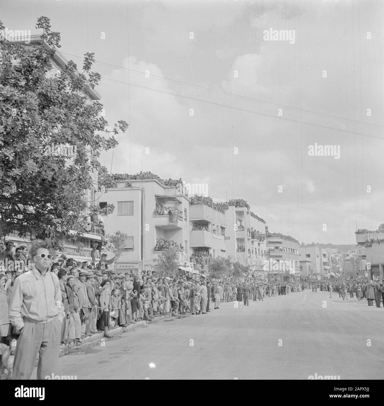 Israel 1948-1949: Haifa  Audience during the military parade in Haifa on the occasion of the first anniversary of Israel's independence on May 15, 1949 Date: May 15, 1949 Location: Haifa, Israel Keywords: architecture, military parades, national holidays, public Stock Photo