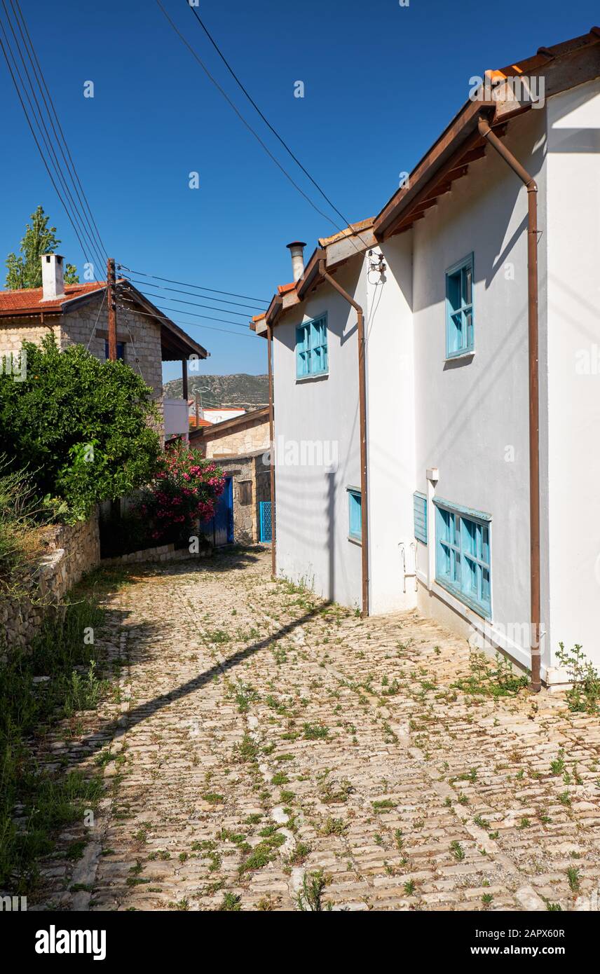 The view of the stone paved narrow streets of the Lania village with its traditional houses and