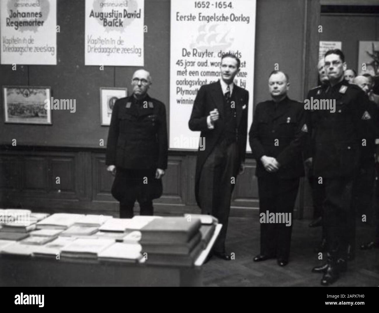 During the Second World War. Anton Mussert, leader of the National Socialist Movement in the Netherlands, during a tour of the De Ruyter Exhibition at the Rijksmuseum in Amsterdam. On the right, Prof. Dr. T. Goedewaagen, on the left the organizer of the exhibition Mr. Wild. Netherlands, 19 June 1942.; Stock Photo