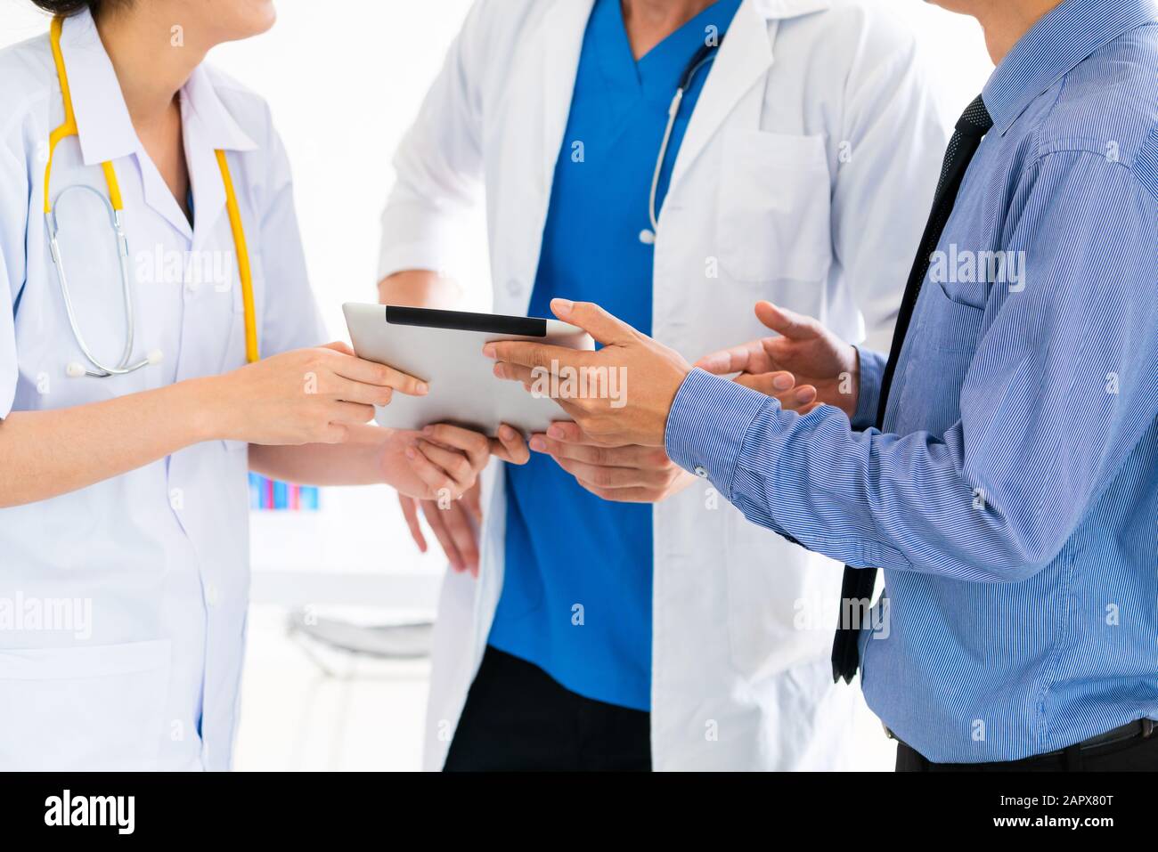 Healthcare people group and scientist meeting. Professional doctor working in hospital office with other doctors, nurse and businessman. Medical techn Stock Photo