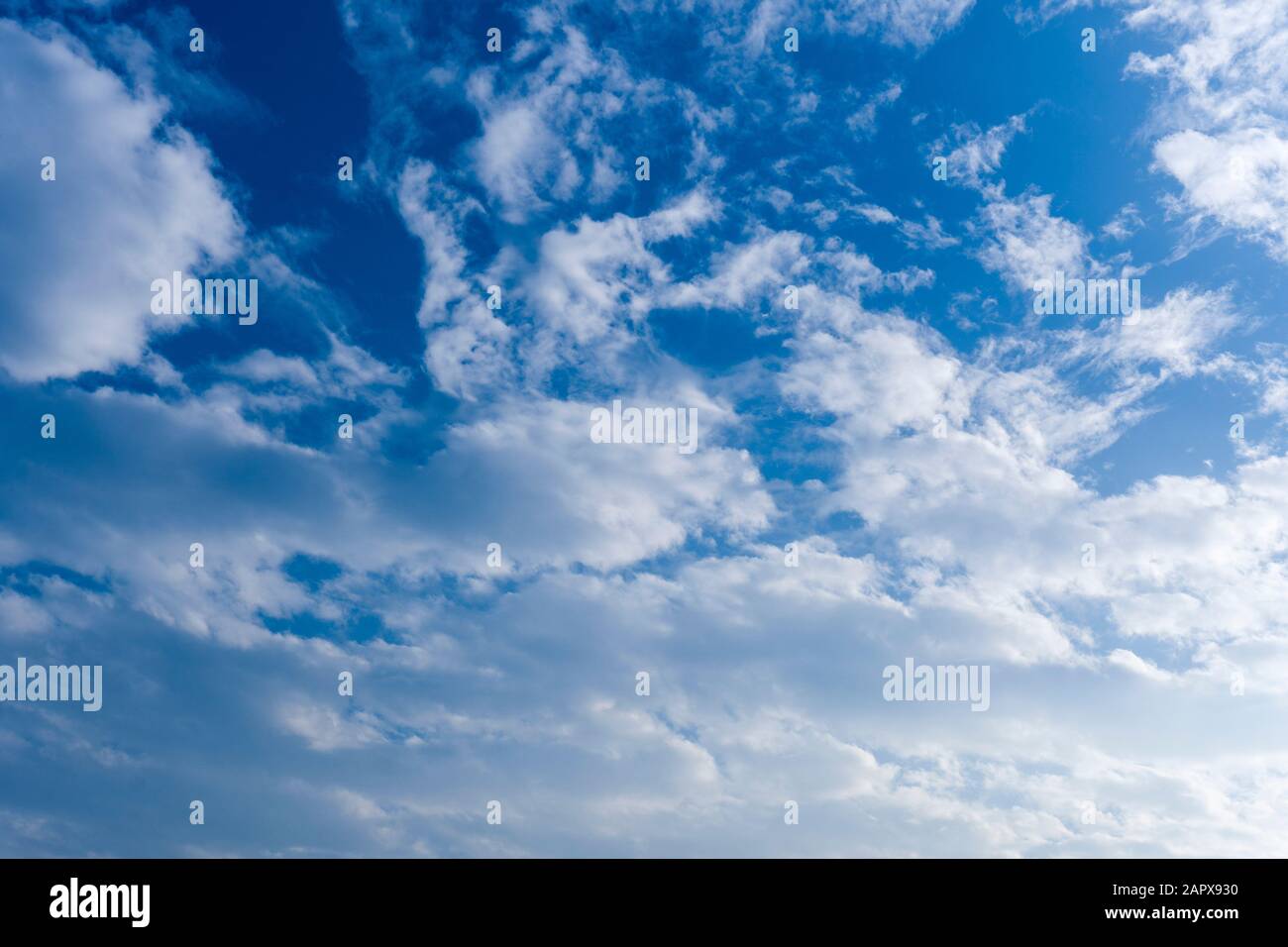 Blue sky with clouds as background or texture Stock Photo - Alamy