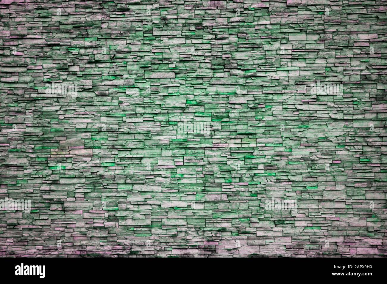 Abstract Irregular Green Color Brick Wall Patterns as Background or Textures Stock Photo