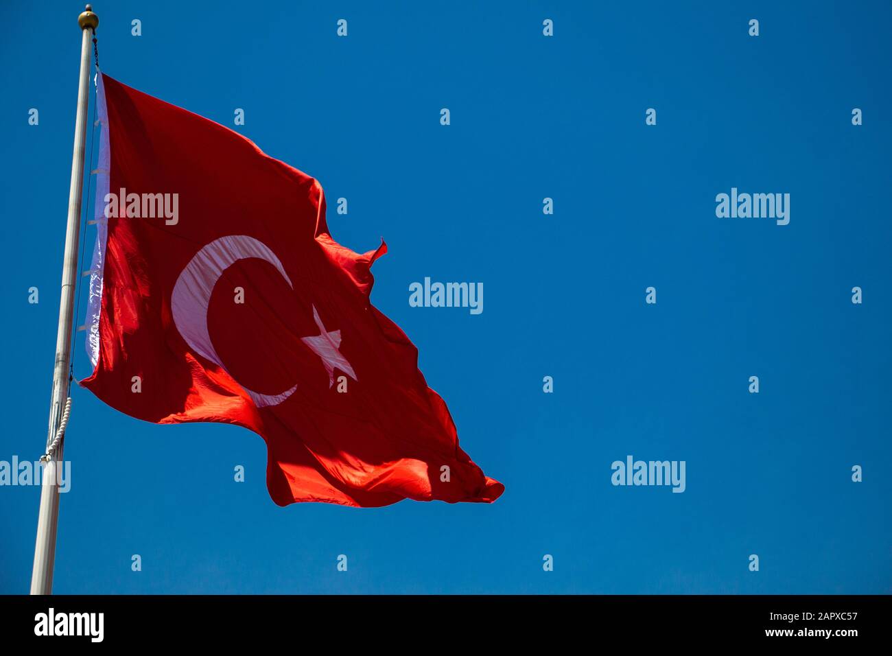 Turkish national flag with white star and moon in sky Stock Photo Alamy