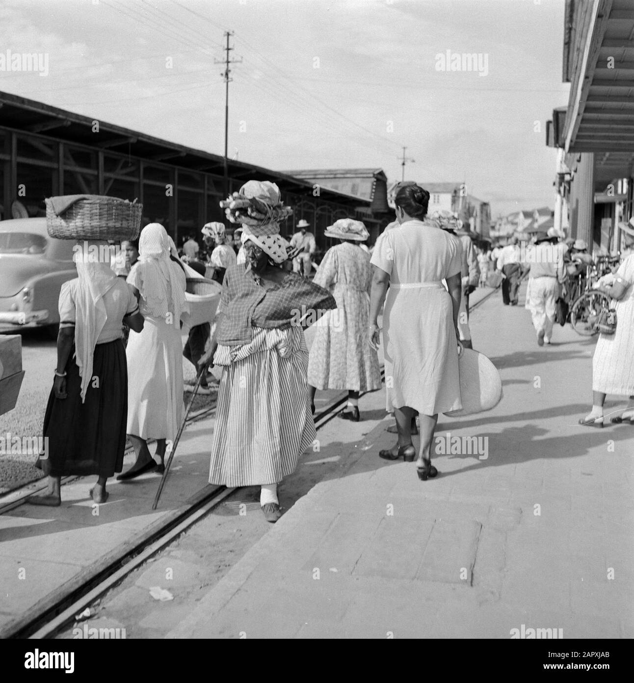 Dutch Antilles and Suriname at the time of the royal visit of Queen Juliana and Prince Bernhard in 1955  Street statue at a market in Paramaribo Date: 1 October 1955 Location: Paramaribo, Suriname Keywords: natives, markets, street images, trams, women Personal name: koto mission Stock Photo