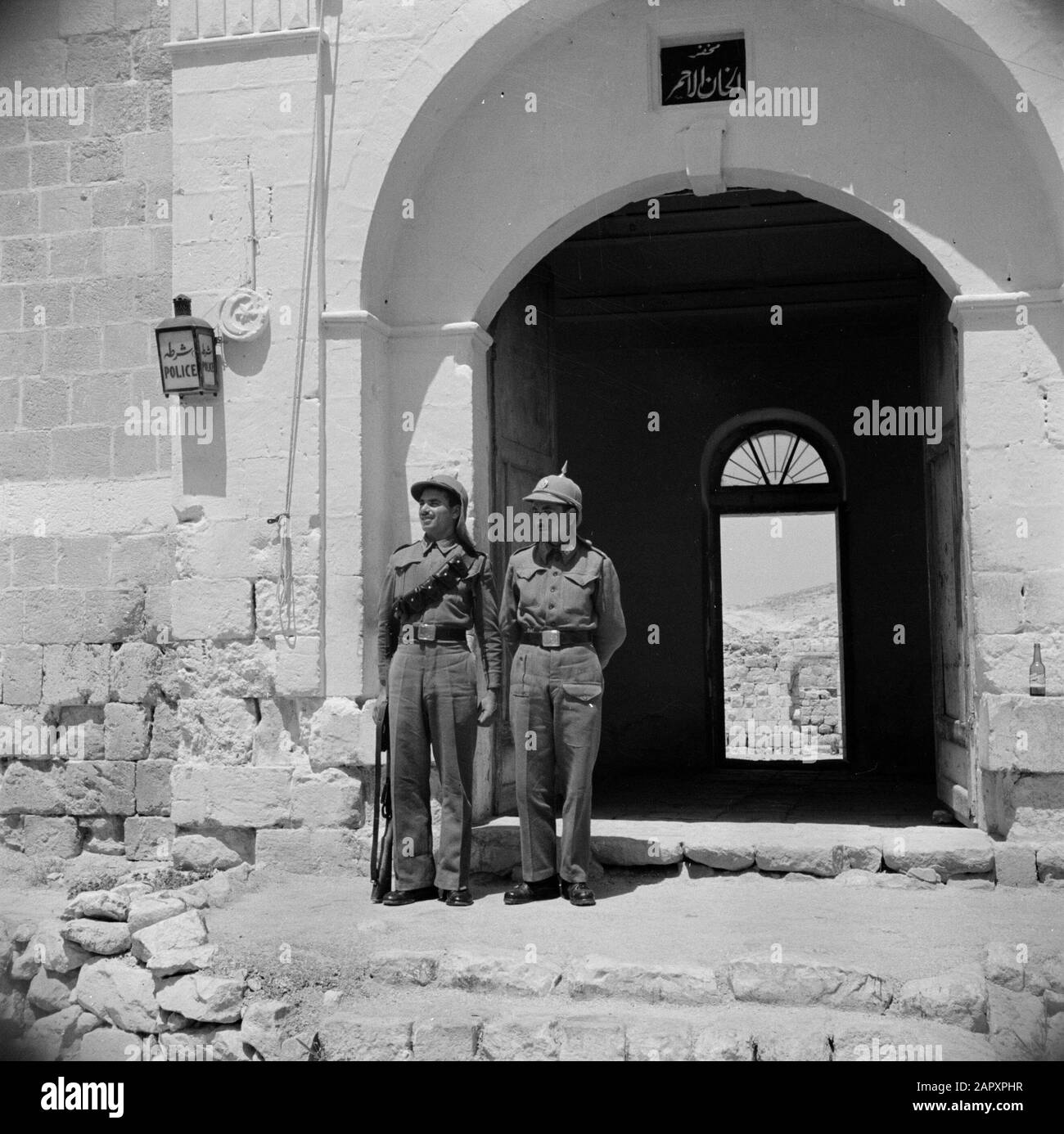 Between Amman and Jerusalem Two police officers in front of the office at  Khan Hathrour Annotation: At the time of the recording this place was in  Jordan Date: 1953-00-00 Location: Jordan, Khan