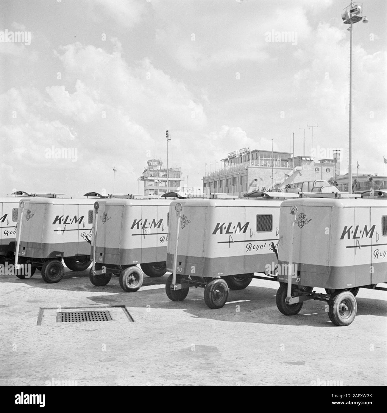 Schiphol and corporate identity KLM Five KLM battery cars on the