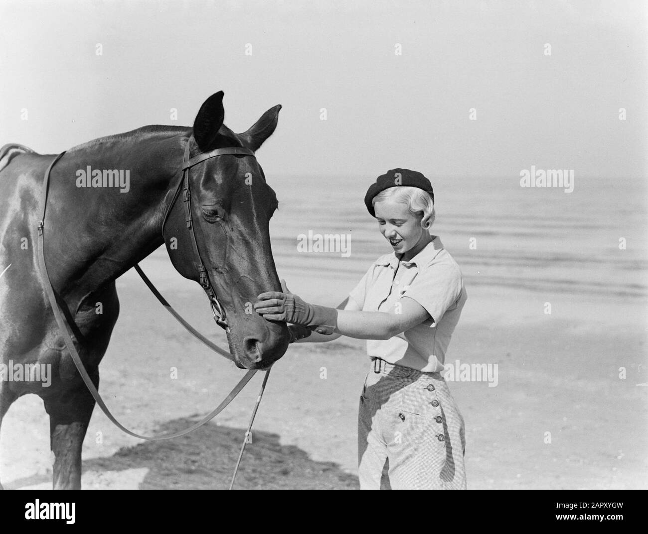 Scheveningen.  Woman with a horse at the beach of Scheveningen Date: undated Keywords: photo models, horses Stock Photo