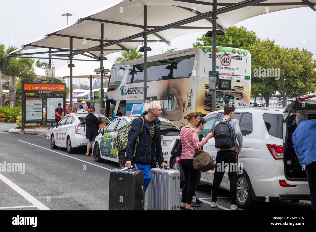 Coolangatta gold coast airport in Queensland, Holidaymakers travelling with suitcases meet a taxi at the airport,Australia Stock Photo