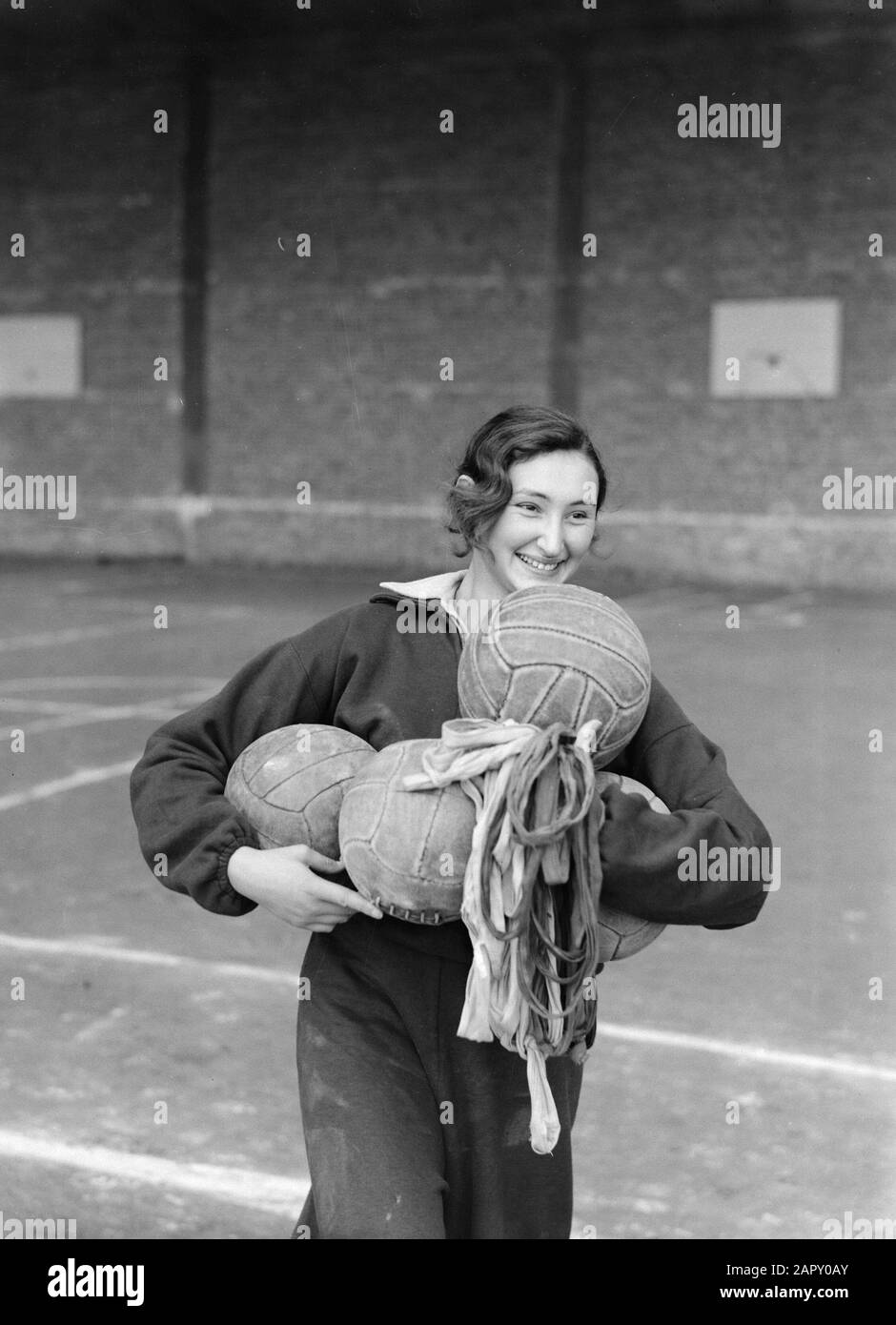 Travel to Poland  Warsaw. Central Institute for Physical Exercise: a female pupil wears three big balls Date: 1934 Location: Poland, Warsaw Keywords: physical education, students Stock Photo
