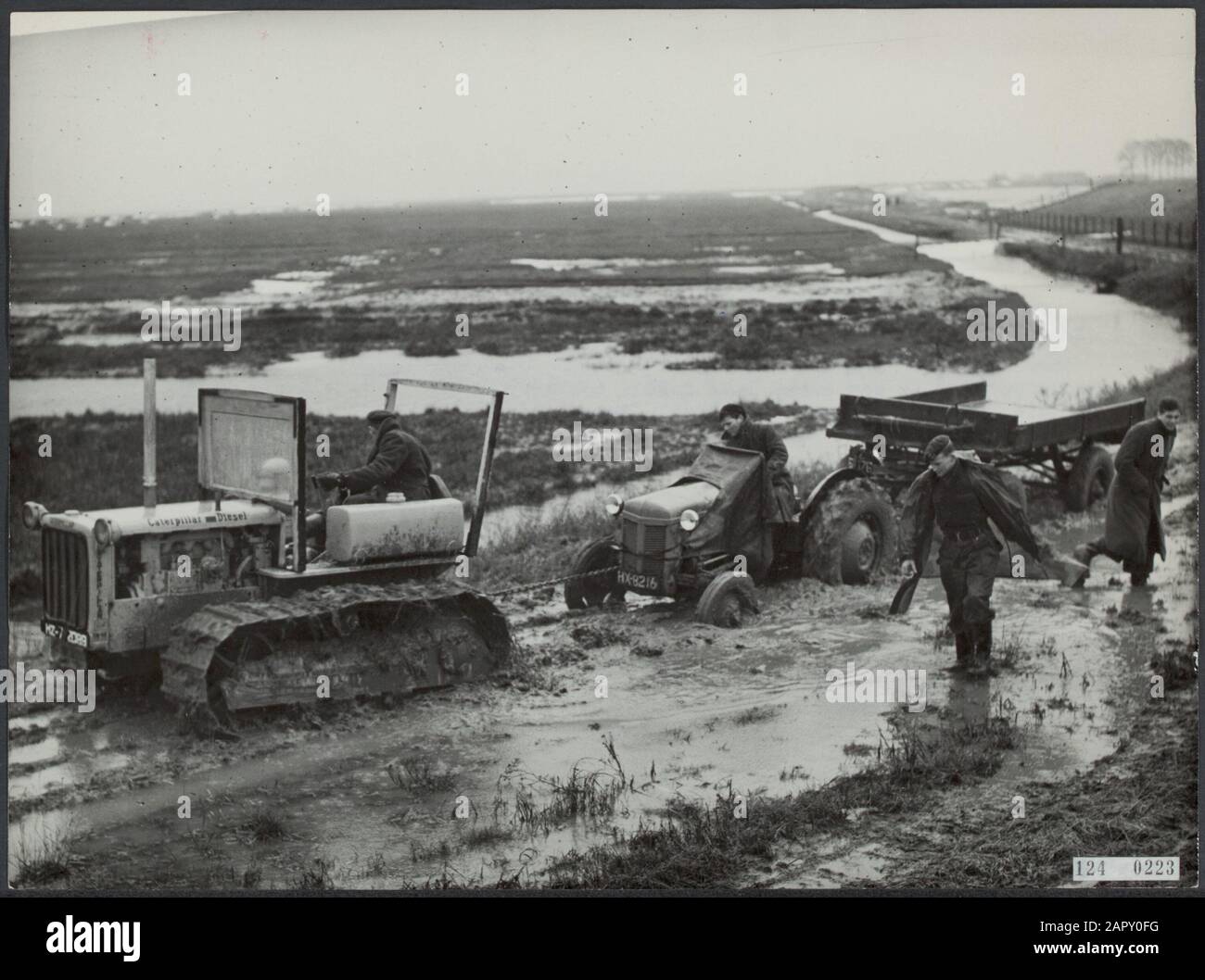 Flood disaster 1953 A tractor tries to pull some vehicles out of the