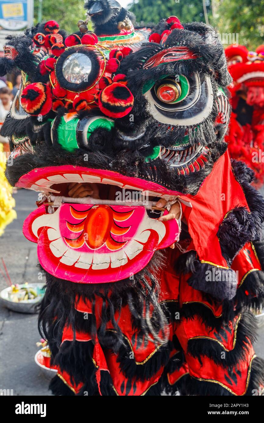 Chinese-Indonesian community celebrating Lunar New Year with Lion dance. Vihara Dharmayana, Chinese Buddhist temple in Kuta, Bali, Indonesia. Stock Photo