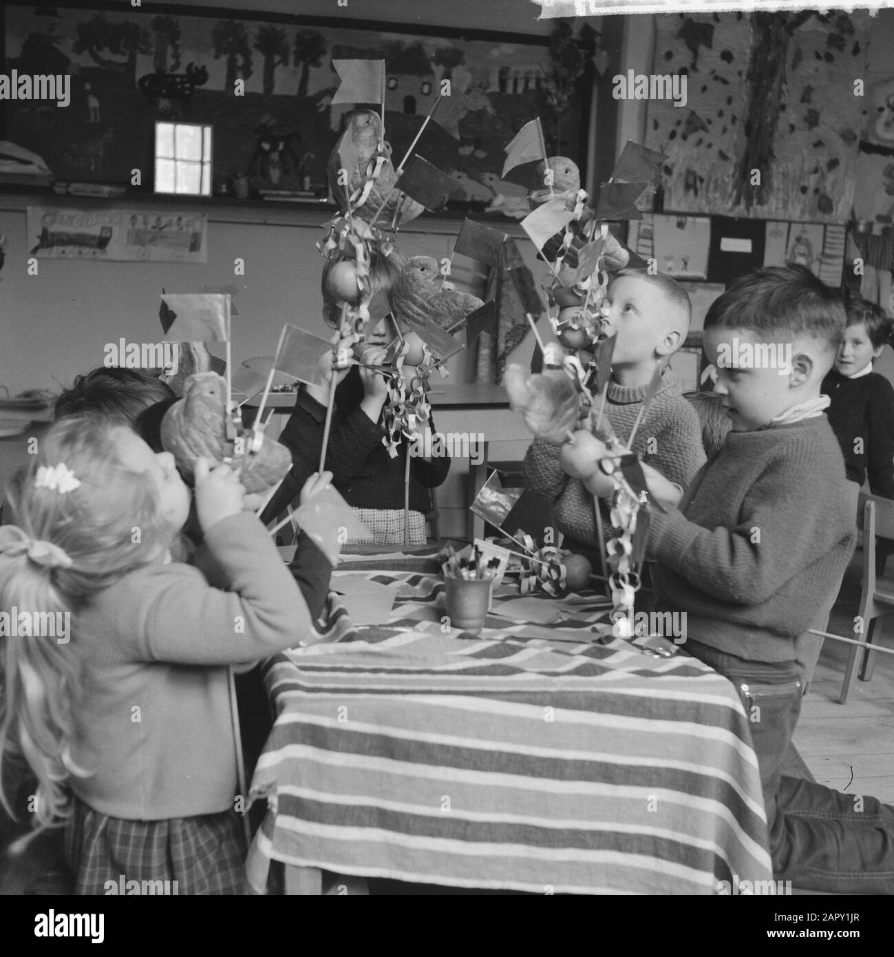 Preparation by children for Palmpases. Children busy formatting the Palmpases Date: March 24, 1961 Keywords: Children.And Stock Photo