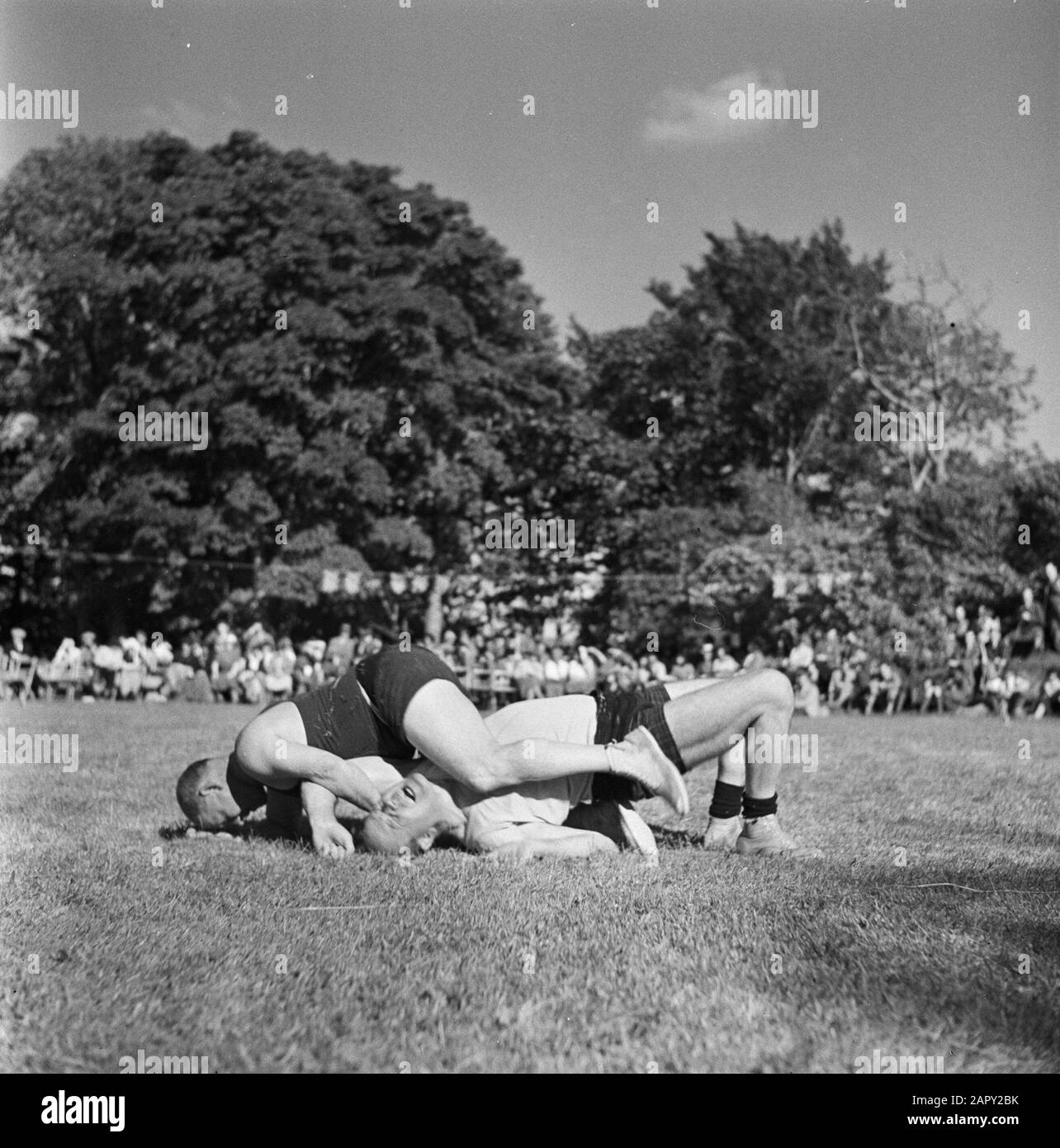 Scotland - The Highlands  Wrestling during the Highland Games, a nineteenth century continuation of traditional clan games from the Highlands of Scotland Date: 1934 Location: Great Britain, Scotland Keywords: folk culture Stock Photo