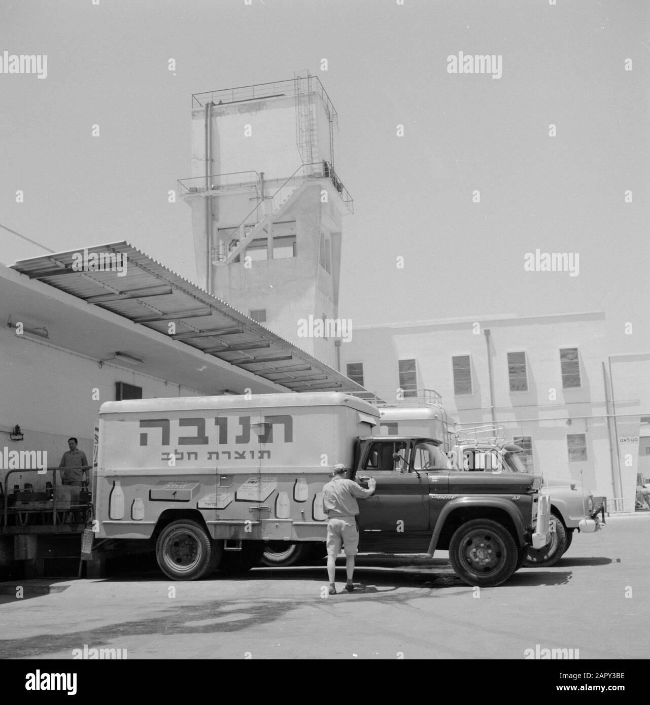 Dairy Tnuva. Truck at the factory building Date: 1 January 1964 Location: Israel Keywords: factories, industry, advertising, trucks Stock Photo