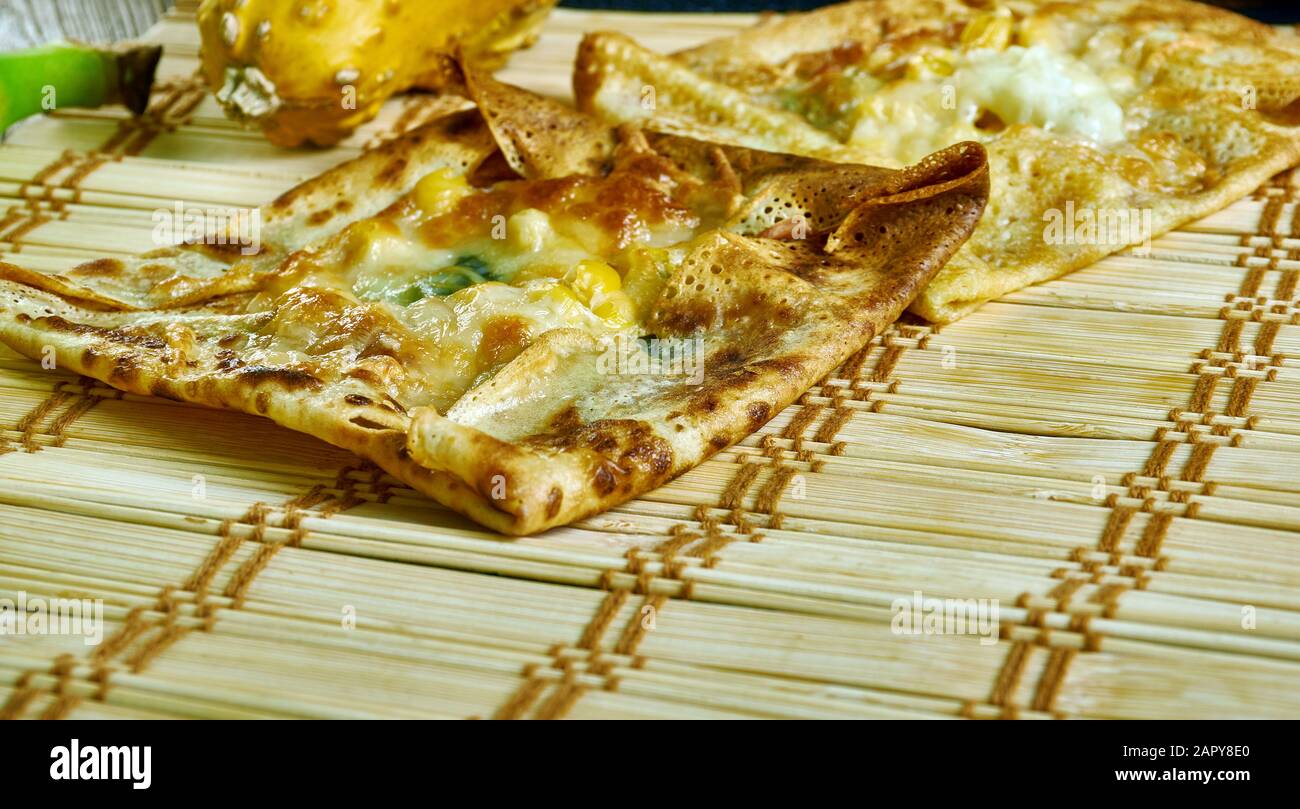 Zanzibar pizza, crispy pancakes with as many meats, sweets, or