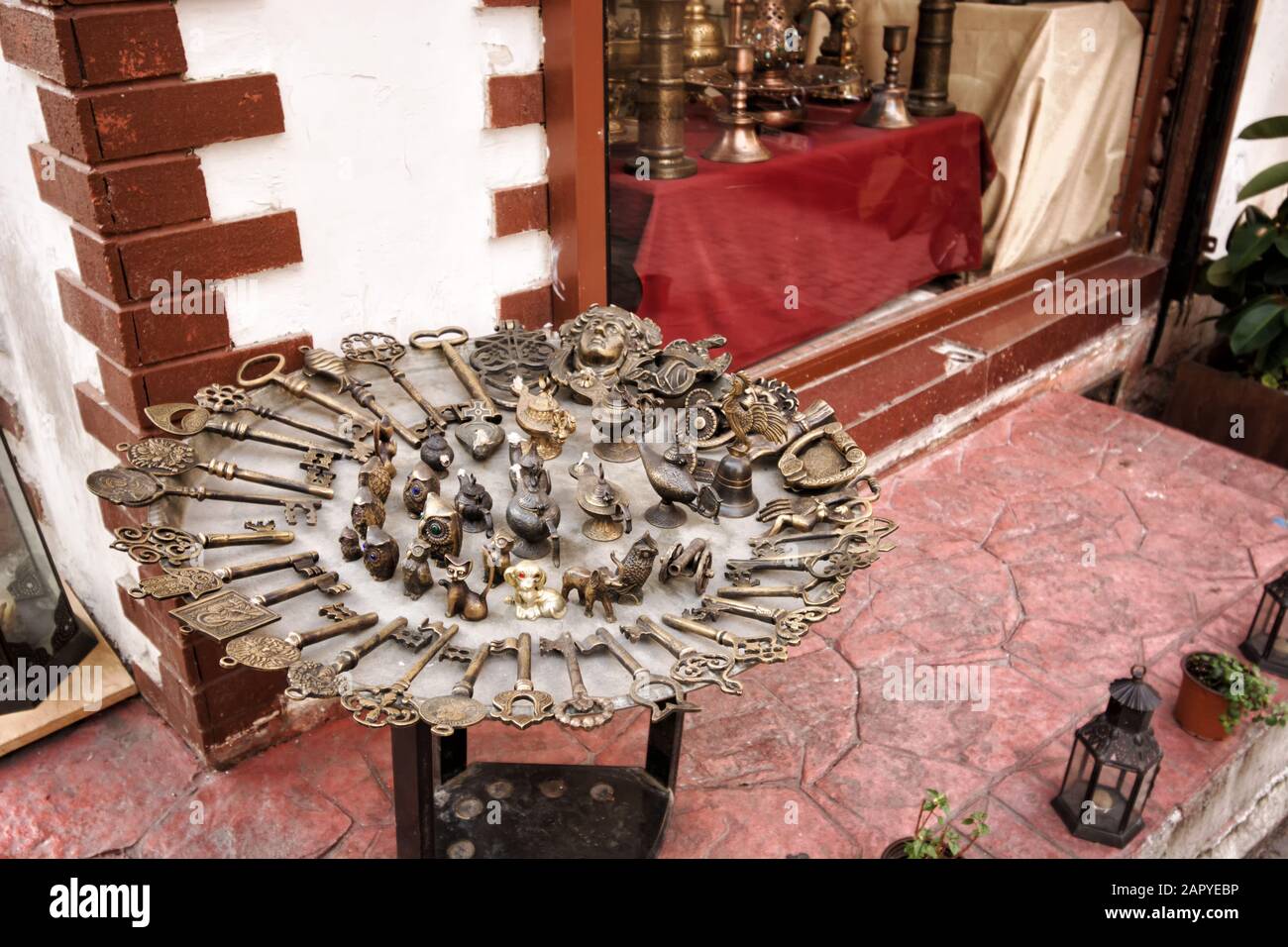 Istanbul, Turkey - January 14, 2020: Display of old metal keys and statuettes at antiques shop in Cukurcuma area of Cihangir, Beyoglu district of Ista Stock Photo