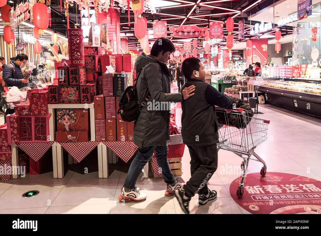 BEIJING CHINA Jan 18 2020 Chinese people go shopping in a local supermarket decorated with Chinese traditional lanterns for Chinese New Year th Stock Photo Alamy