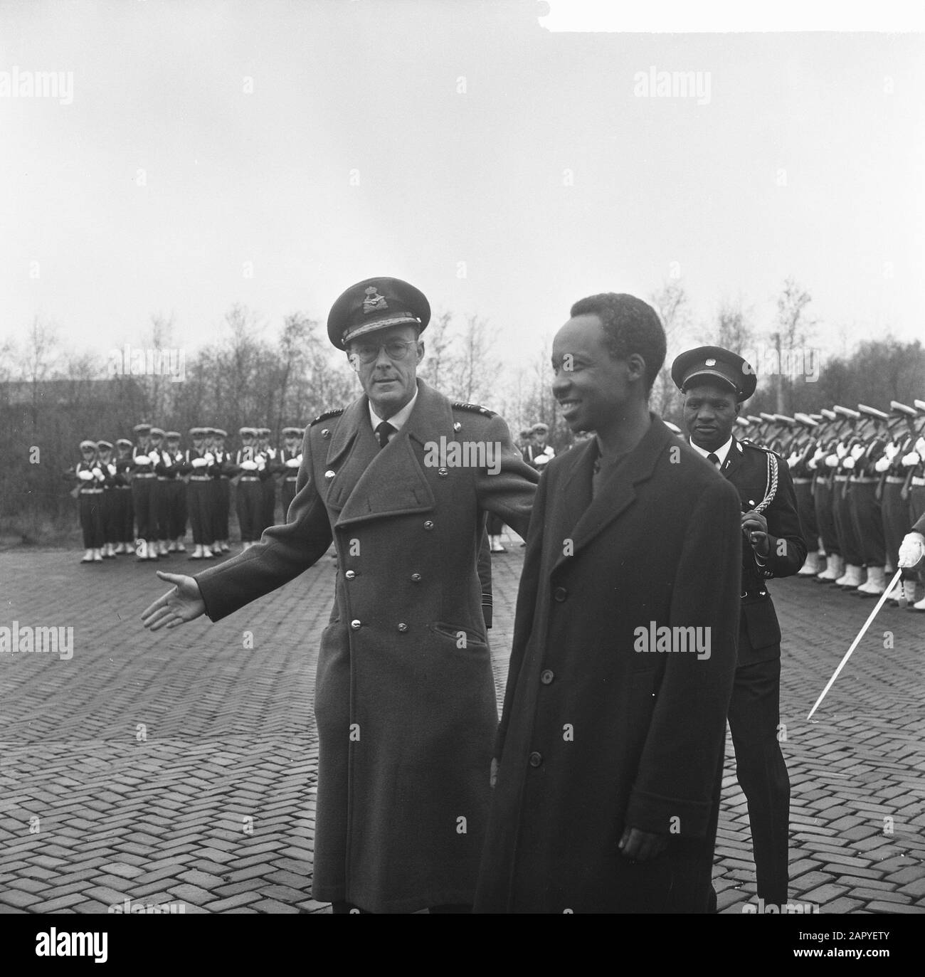 State visit President Nyerere of Tanzania, Prince Bernhard and President Nyerere after the inspection of the honorary guard at Soesterberg Airport Date: 21 April 1965 Location: Soesterberg, Utrecht Keywords: honorary guards, presidents, princes, state visits, airports Personal name: Bernhard (prince Netherlands), Nyerere, Julius Stock Photo