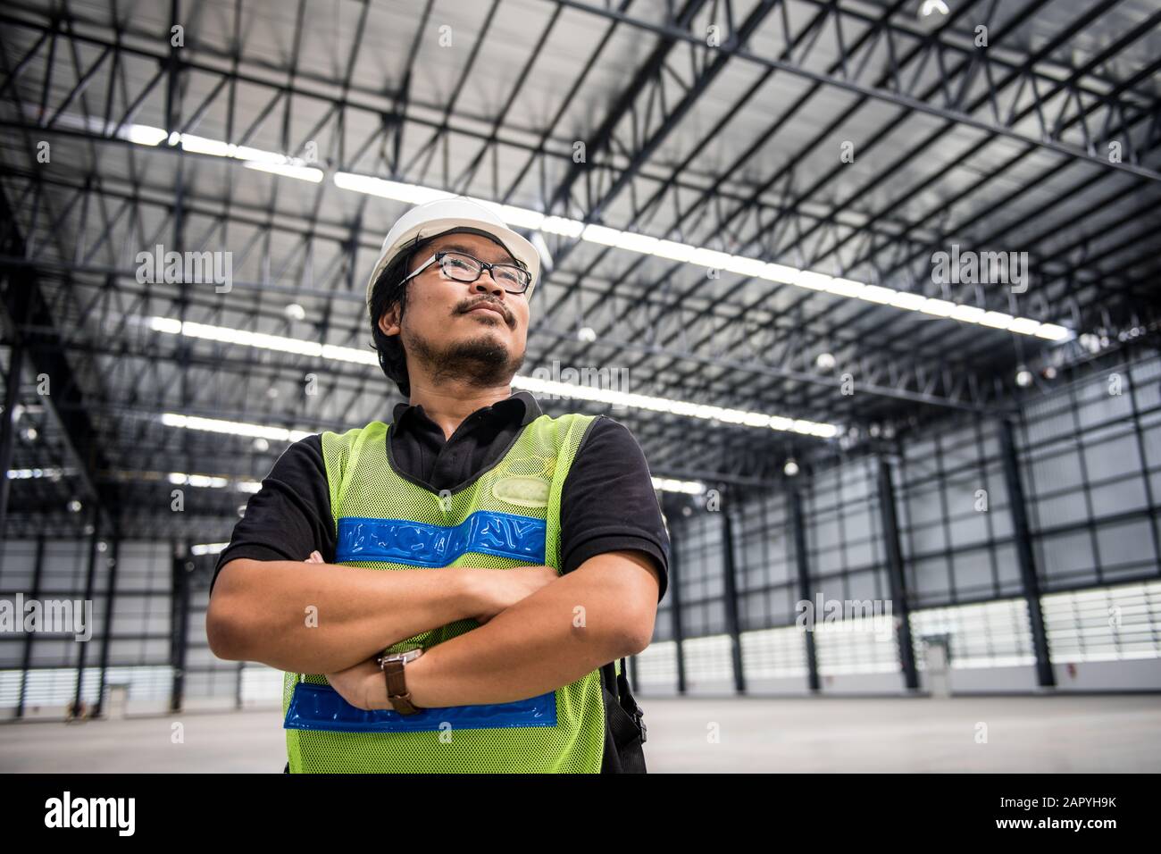 Engineer working and standing in new warehouse and space area Stock Photo