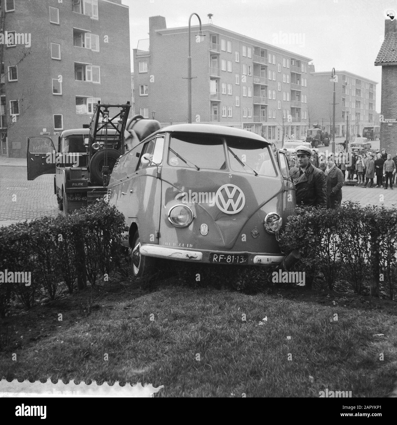 Volkswagen van in garden, by collision in New West Date: December 16, 1959 Keywords: Collisions, gardens Institution name: Volkswagen Stock Photo