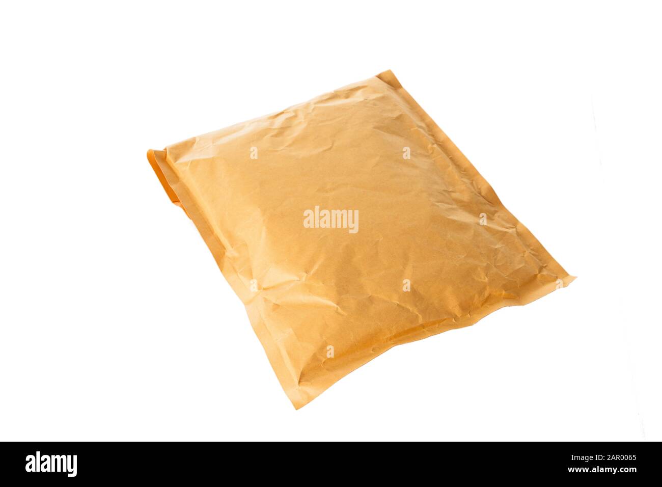 Small paper post packet isolated on the white background Stock Photo