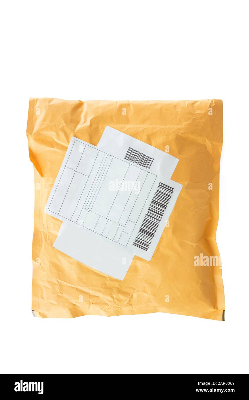 Small paper post packet isolated on the white background Stock Photo