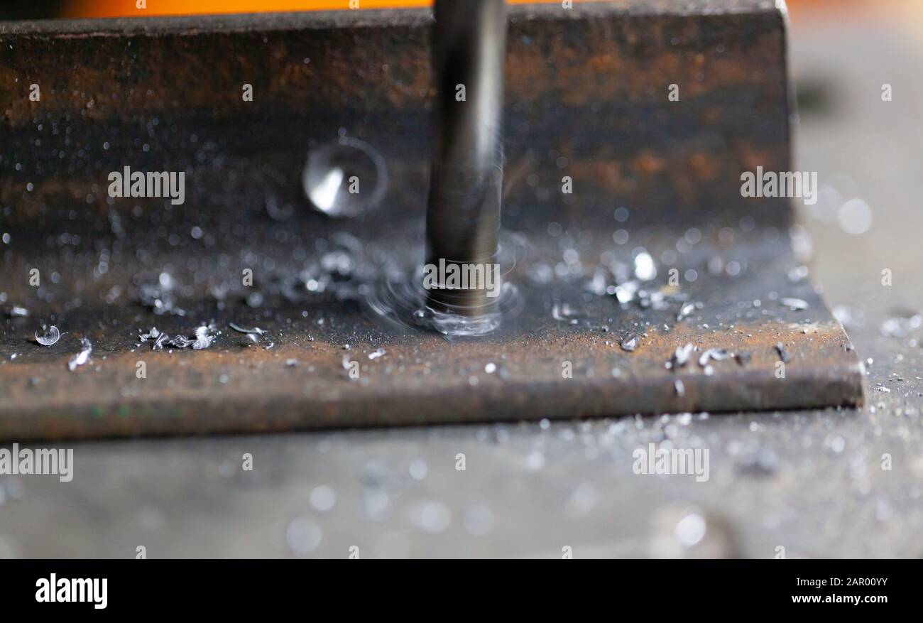 Drilling a hole in metal. Macro scale Stock Photo Alamy