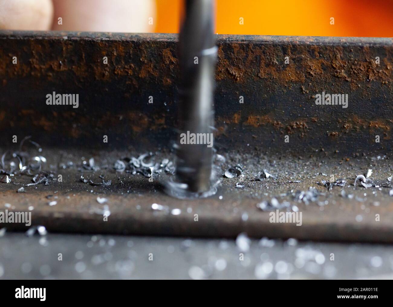 Drilling a hole in metal. Macro scale Stock Photo Alamy