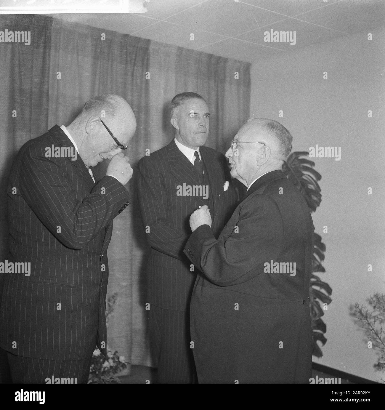 Opening new building of the OLVEH to the Damrak Annotation: OLVEH = Mutual Insurance Company Private Help (merged in 1968 in AGO, later Aegon) Date: 29 January 1962 Location: Amsterdam Keywords: insurance companies Institution name: OLVEH Stock Photo