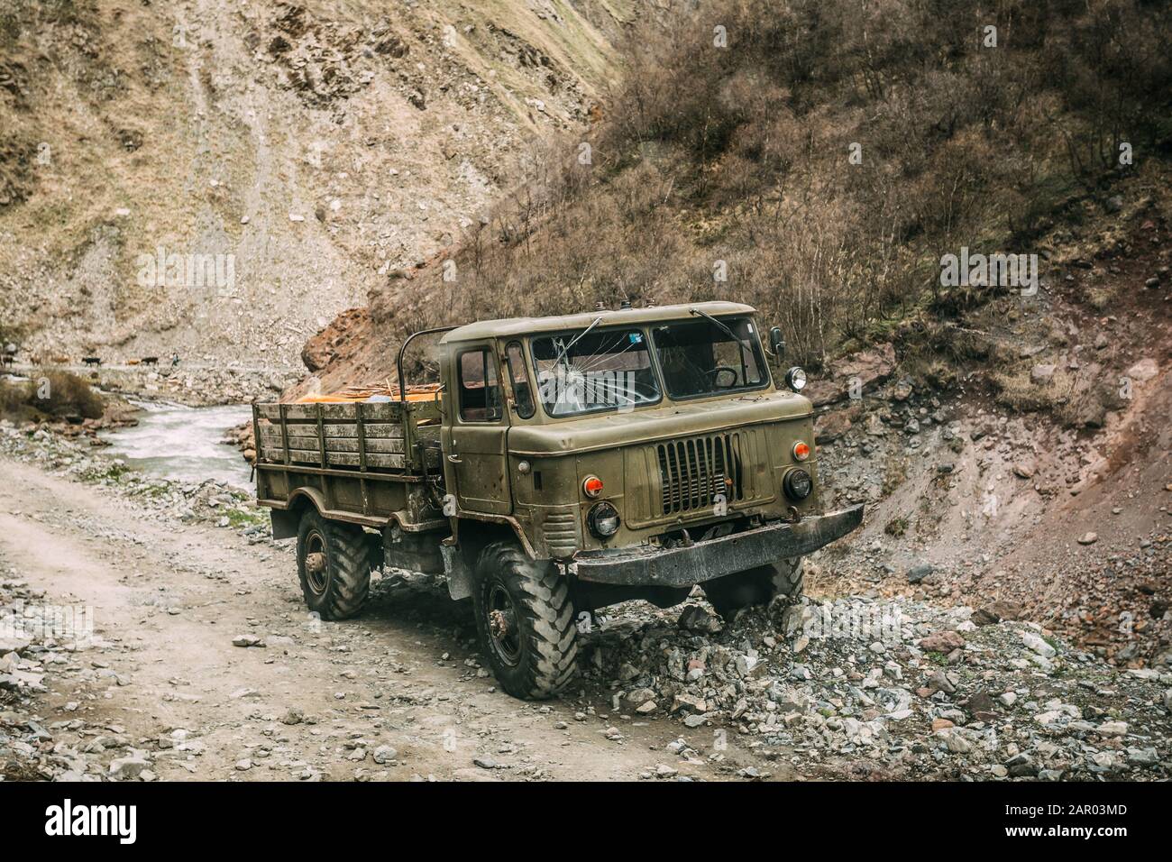 Old Soviet Russian Medium-duty Truck On Mountains Country Road. Truso Gorge, Kazbegi District, Mtskheta-Mtianeti Region, Georgia. Stock Photo
