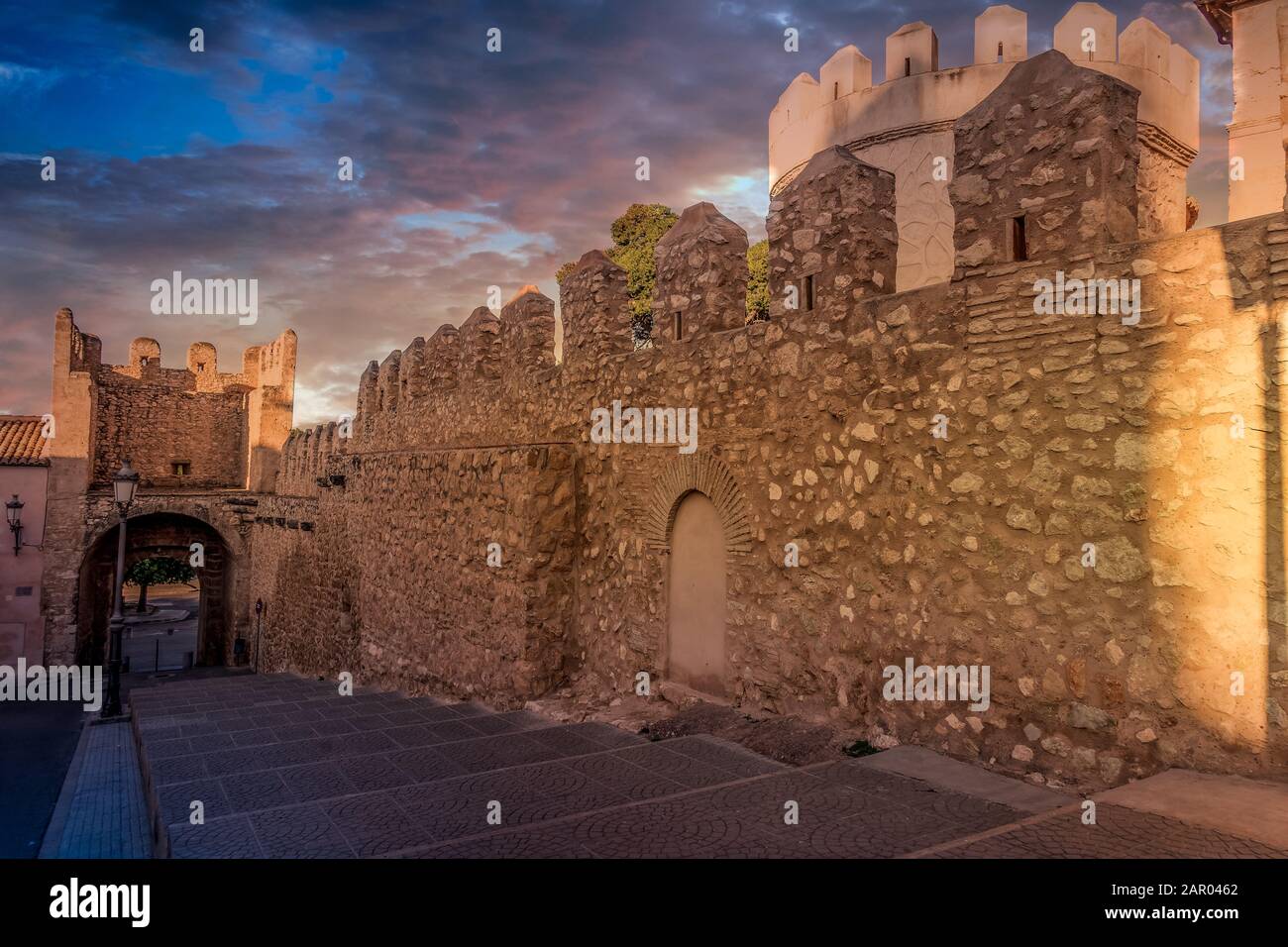 Pou medieval gate near Benisano castle in Valencia province Spain with dramatic sunset sky Stock Photo