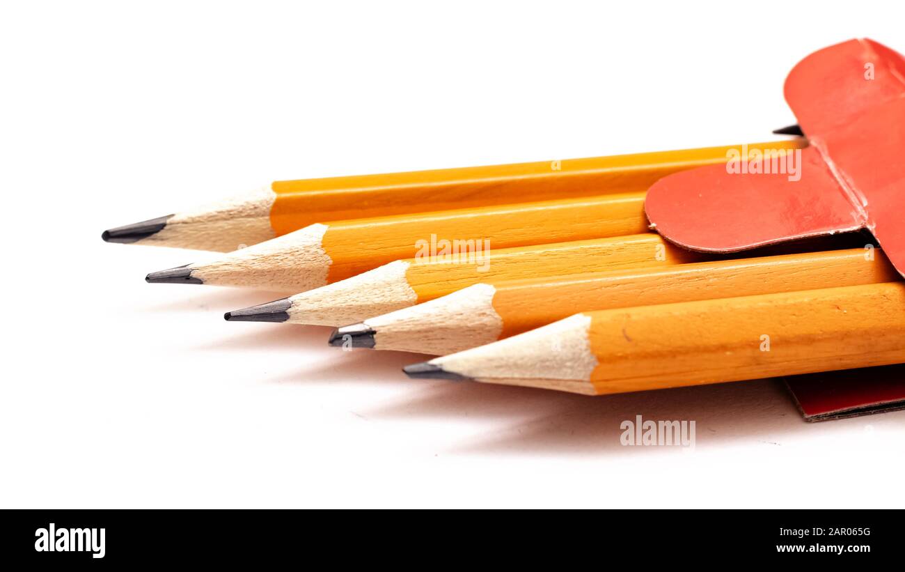 Five pencils on white background, macro photo Stock Photo