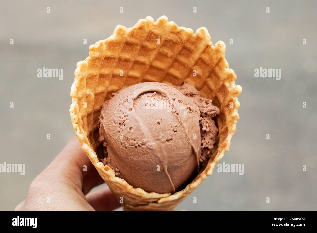 Chocolate ice cream in a waffle cone Stock Photo - Alamy