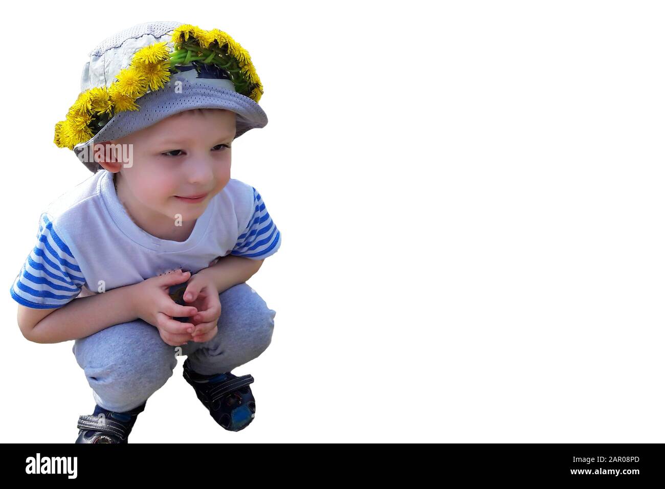 pictured in the photo boy with a wreath of dandelions on a whithe background Stock Photo